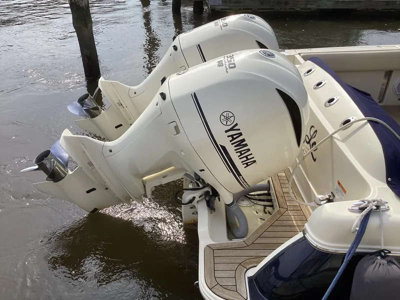 Slide: The Image of 2016 Chris-Craft 34 Catalina with twin Yamaha outboard engines docked on water. - 37