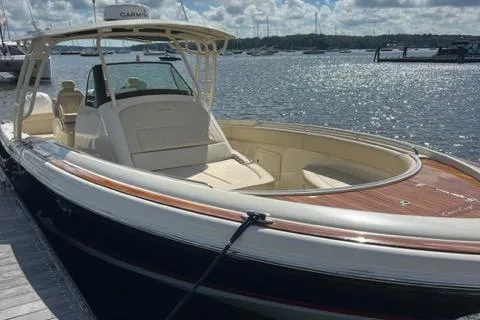 Slide: The Image of 2016 Chris-Craft 34 Catalina boat docked by the water on a sunny day. - 4