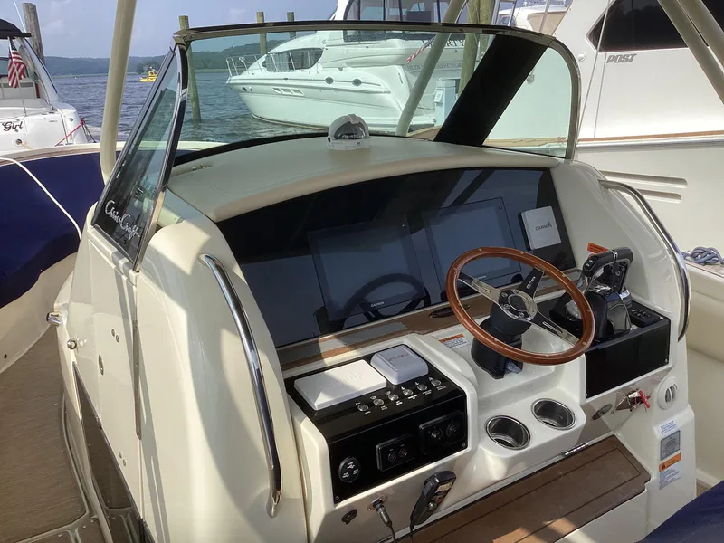 Slide: The Image of 2016 Chris-Craft 34 Catalina helm with modern controls and steering wheel. - 40