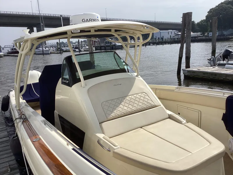 Slide: The Image of 2016 Chris-Craft 34 Catalina boat docked, featuring Garmin equipment and spacious seating. - 42