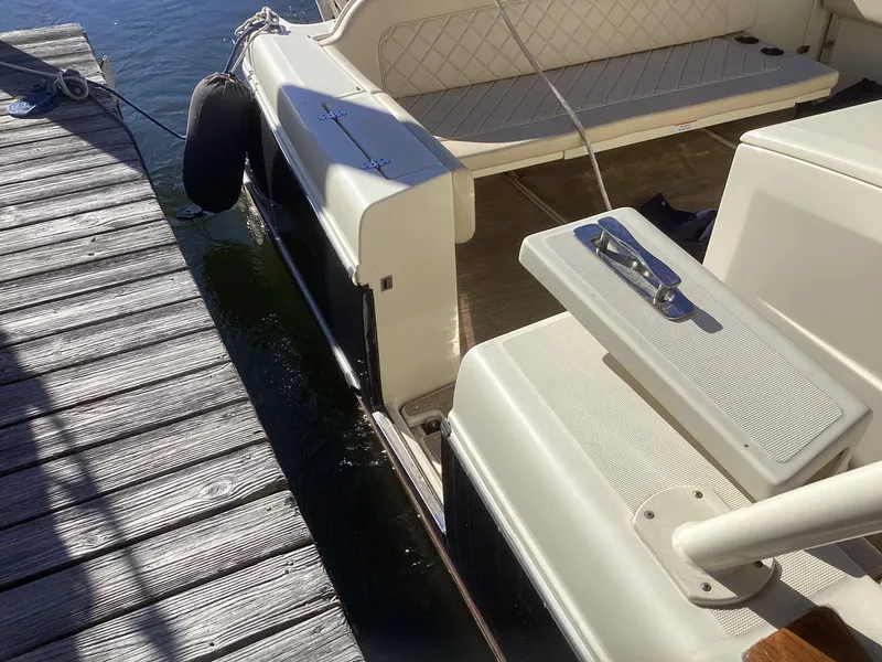 Slide: The Image of 2016 Chris-Craft 34 Catalina docked, showing deck and seating area. - 48