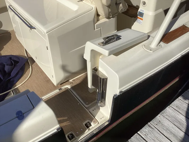 Slide: The Image of 2016 Chris-Craft 34 Catalina boat interior, featuring seating and deck details. - 49
