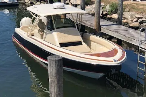 Slide: The Image of 2016 Chris-Craft 34 Catalina boat docked in a marina. - 7