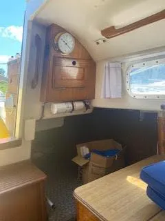 Slide: The Image of Interior of 1978 Bristol 29.9 Sloop sailboat with wooden cabinetry and nautical decor. - 8