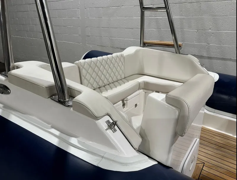 Slide: The Image of 2024 Apex A-18 Deluxe Tender with elegant white seating and stainless steel accents. - 9