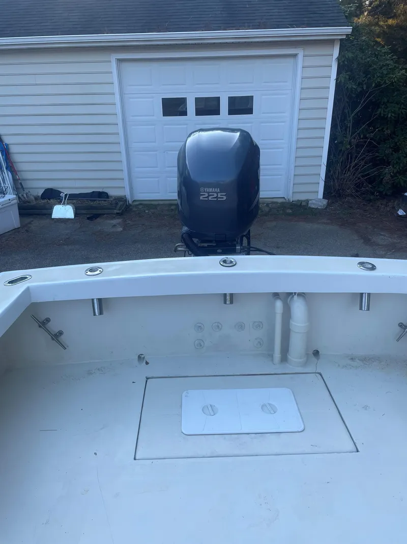 Slide: The Image of Custom Carolina Bandy 26' boat, 2000 model, with Yamaha 225 engine in driveway. - 14
