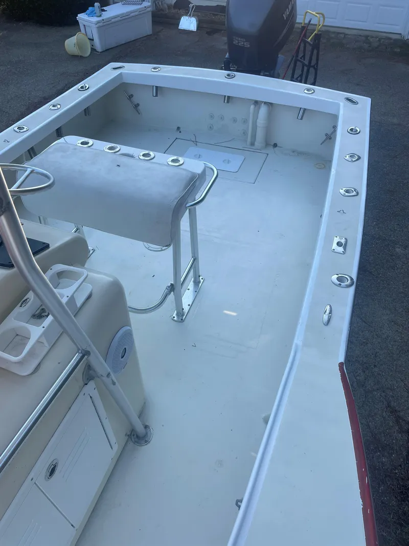 Slide: The Image of Custom Carolina Bandy 26' boat interior, 2000 model, featuring spacious deck and seating. - 15