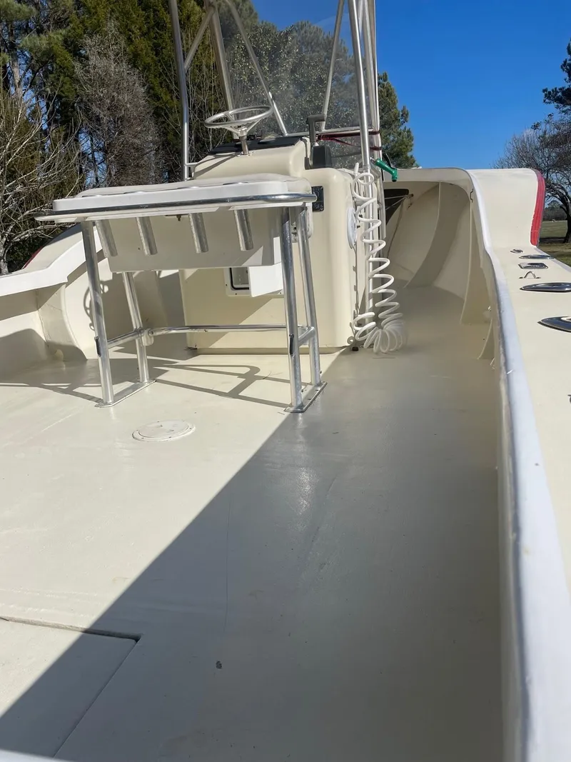 Slide: The Image of Custom Carolina Bandy 26' boat deck, 2000 model, with fishing rod holders and steering console. - 16