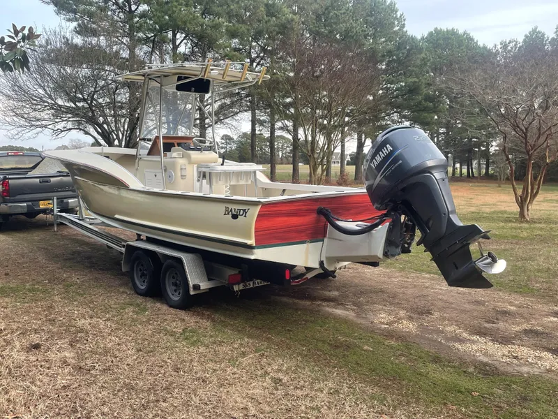 Slide: The Image of Custom Carolina Bandy 26' boat, 2000 model, on trailer with Yamaha outboard motor. - 2
