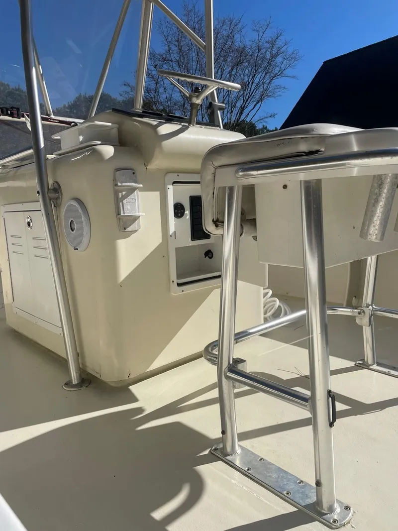 Slide: The Image of Custom Carolina Bandy 26' boat interior, 2000 model, featuring helm and seating area. - 20