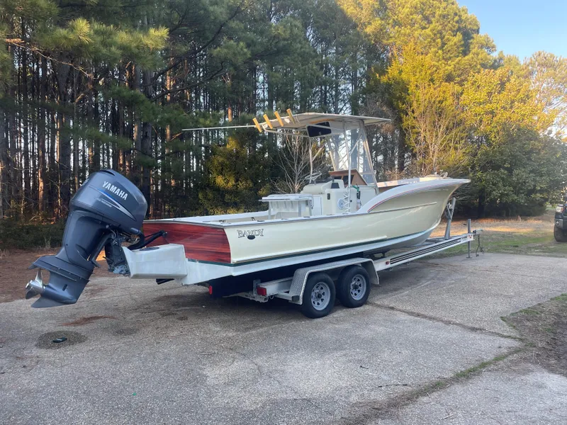 Slide: The Image of Custom Carolina Bandy 26' boat, 2000 model, on trailer with Yamaha outboard motor. - 3