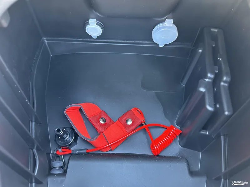 Slide: The Image of 2024 Yamaha WaveRunner FX Cruiser HO storage compartment with red safety lanyard. - 8