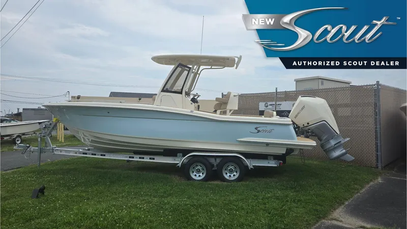 The Image of 2024 Scout 240 XSF boat on trailer at authorized dealer, side view. - 0
