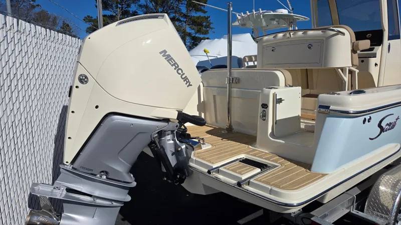 Slide: The Image of 2024 Scout 240 XSF boat with Mercury outboard motor, featuring a spacious deck and modern design. - 7