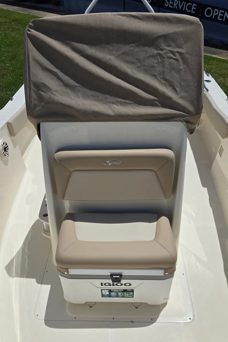 Slide: The Image of 2025 Scout 195 Sportfish boat seating and Igloo cooler. - 6