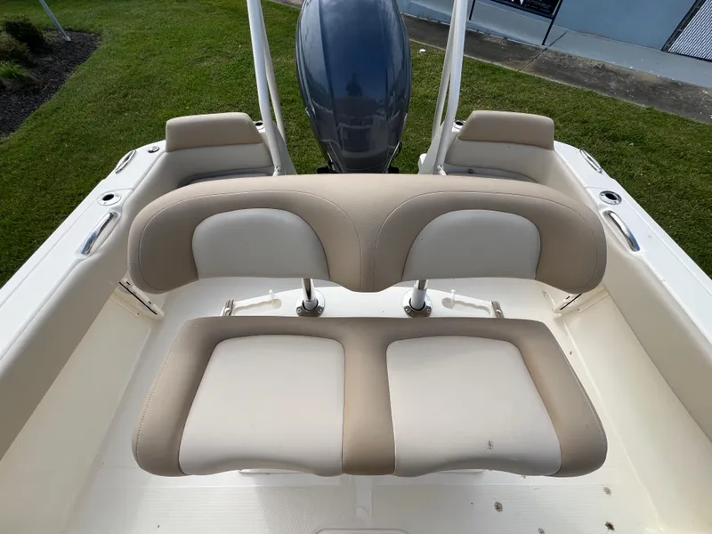 Slide: The Image of 2025 Scout 195 Sportfish boat with beige and white seating. - 9
