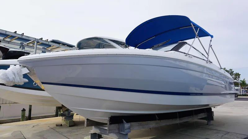 Slide: The Image of 2024 Cobalt R4 boat with blue canopy on display. - 1