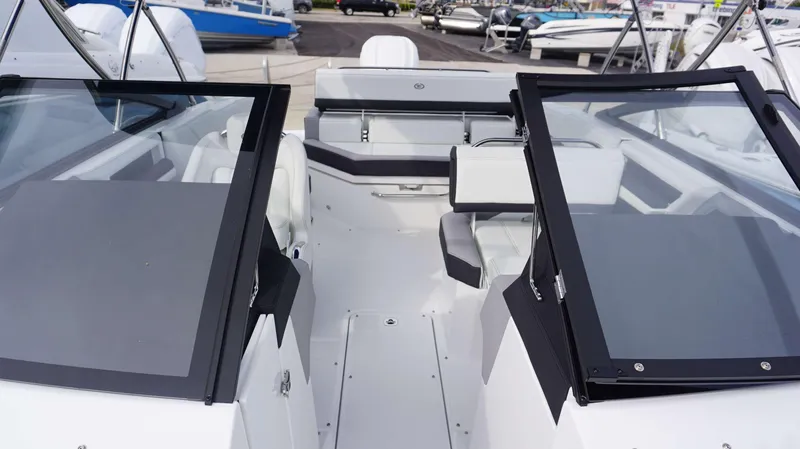 Slide: The Image of 2024 Cobalt R4 boat interior with open windshield and seating area. - 7