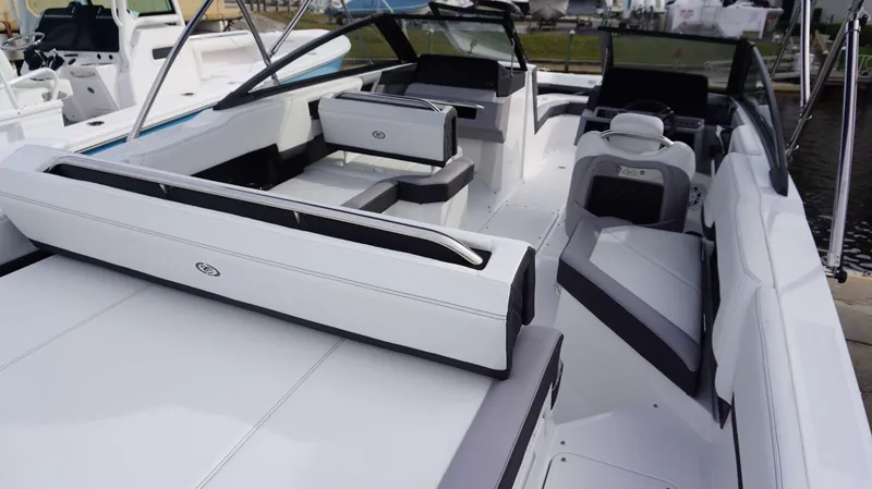 Slide: The Image of 2024 Cobalt R4 boat interior with white and gray seating, modern design. - 9