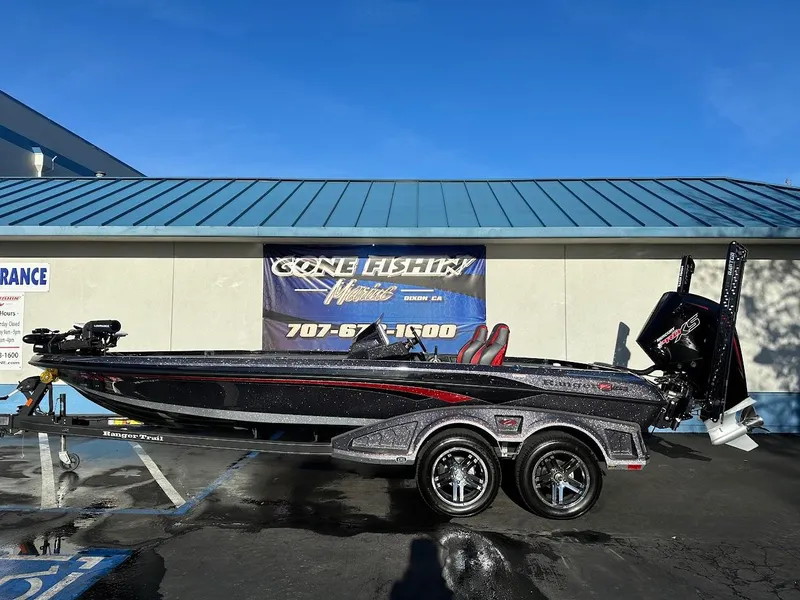 Slide: The Image of 2024 Ranger Z521R Ranger Cup Equipped boat on trailer, parked outside dealership. - 0
