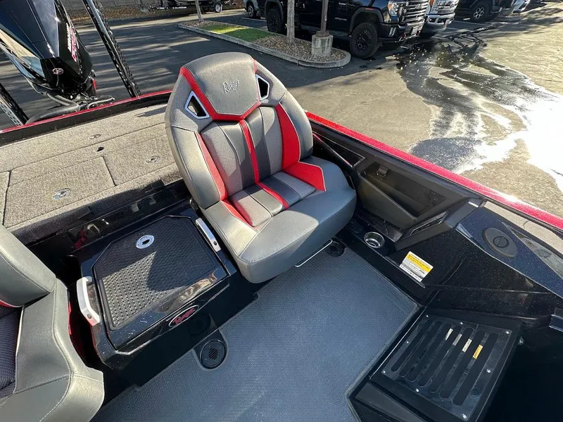 Slide: The Image of 2024 Ranger Z521R boat interior with gray and red seating, modern design. - 10