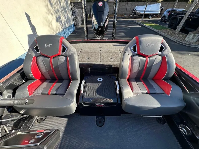 Slide: The Image of 2024 Ranger Z521R boat seats with red and gray design. - 11