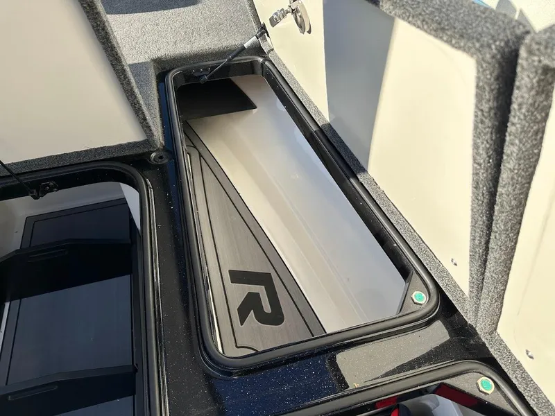 Slide: The Image of 2024 Ranger Z521R storage compartment with sleek design and durable materials. - 25