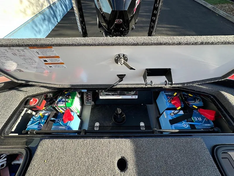 Slide: The Image of 2024 Ranger Z521R Ranger Cup boat battery compartment with organized wiring and components. - 31