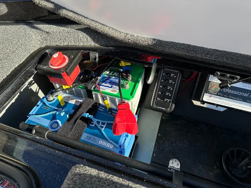 Slide: The Image of 2024 Ranger Z521R Ranger Cup Equipped boat battery compartment with wiring and controls. - 32