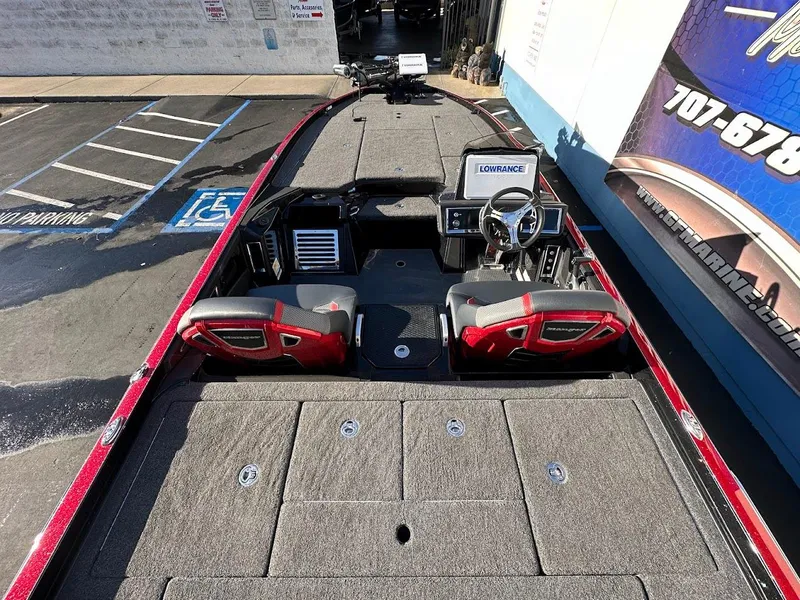 Slide: The Image of 2024 Ranger Z521R boat interior with red accents and Lowrance equipment. - 6