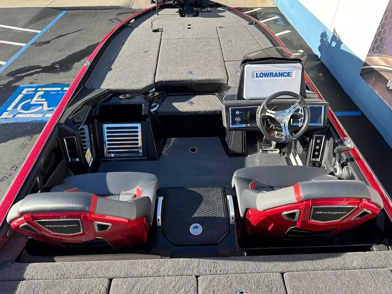 Slide: The Image of 2024 Ranger Z521R boat interior with Lowrance electronics and dual seats. - 7