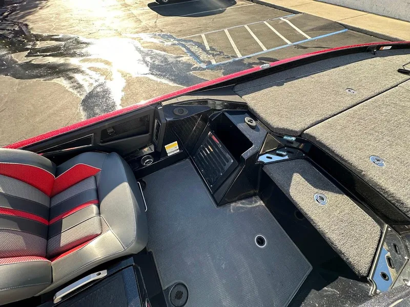 Slide: The Image of 2024 Ranger Z521R Ranger Cup boat interior with seating and storage compartments. - 9
