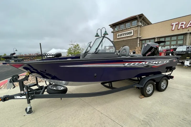 The Image of 2024 Tracker Targa V-19 WT boat on trailer, parked outside dealership. - 0