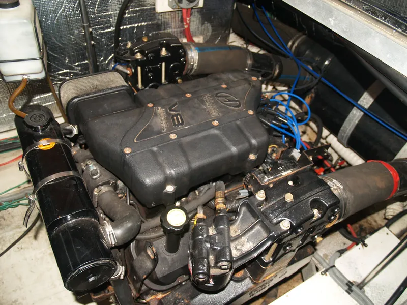 Slide: The Image of Engine compartment of a 2001 Cruisers 3750 boat, showcasing detailed mechanical components. - 19