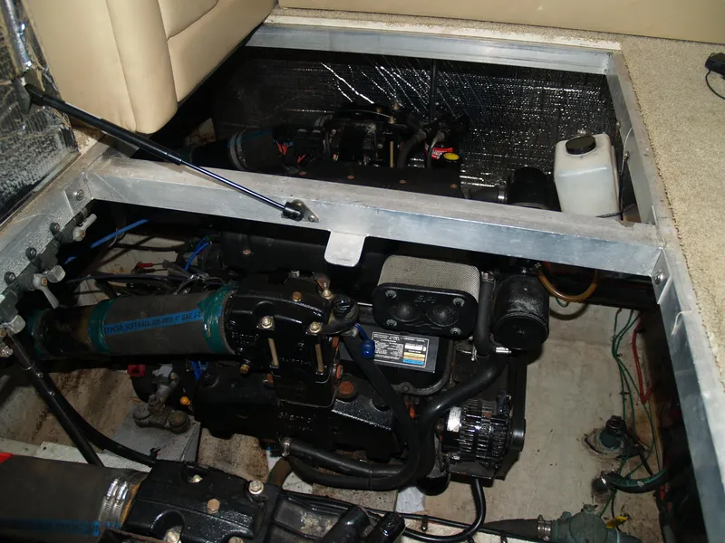Slide: The Image of Engine compartment of a 2001 Cruisers 3750 boat, showcasing mechanical components and wiring. - 20
