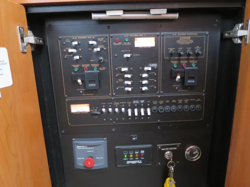 Slide: The Image of Electrical control panel of a 2001 Cruisers 3750 boat, featuring switches and indicators. - 7