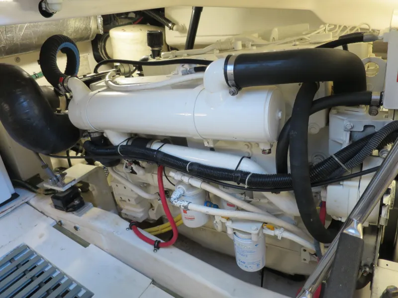 Slide: The Image of Engine compartment of a 2004 Tiara Yachts 3800 Open, showcasing the engine and components. - 16