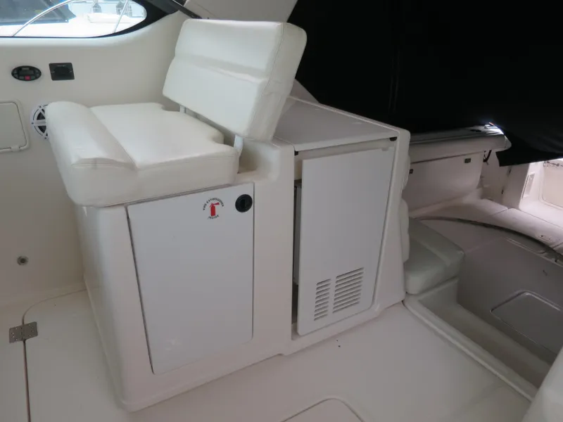 Slide: The Image of 2004 Tiara Yachts 3800 Open interior seating and storage area. - 8