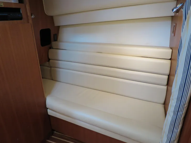 Slide: The Image of 2004 Tiara Yachts 3800 Open interior seating with beige cushions. - 9