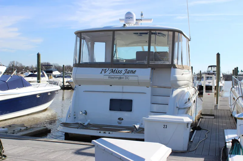 Slide: The Image of 2002 Sea Ray 480 Motor Yacht docked at marina, rear view. - 1