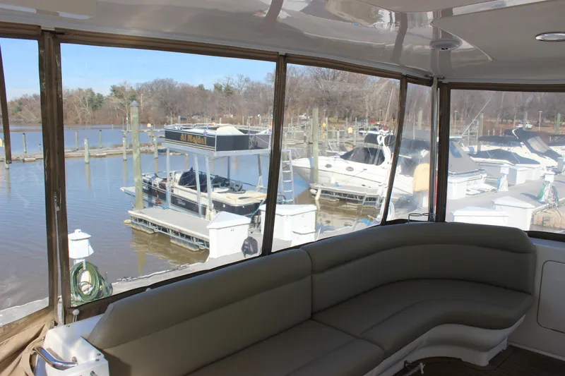 Slide: The Image of View from the 2002 Sea Ray 480 Motor Yacht, overlooking a marina with docked boats. - 12