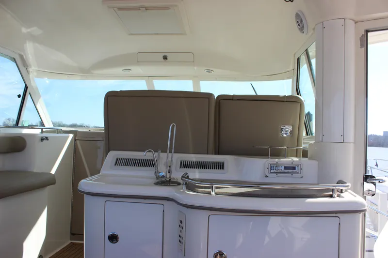 Slide: The Image of Interior of a 2002 Sea Ray 480 Motor Yacht with a sink and seating area. - 14