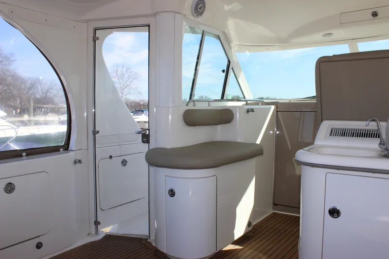 Slide: The Image of Interior of 2002 Sea Ray 480 Motor Yacht with seating and windows. - 15