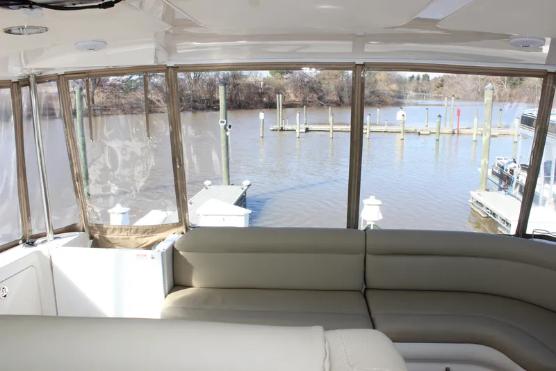 Slide: The Image of Interior view of 2002 Sea Ray 480 Motor Yacht with waterfront backdrop. - 16
