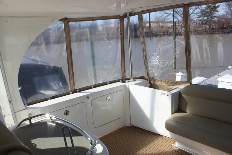Slide: The Image of Interior view of 2002 Sea Ray 480 Motor Yacht with river backdrop. - 19