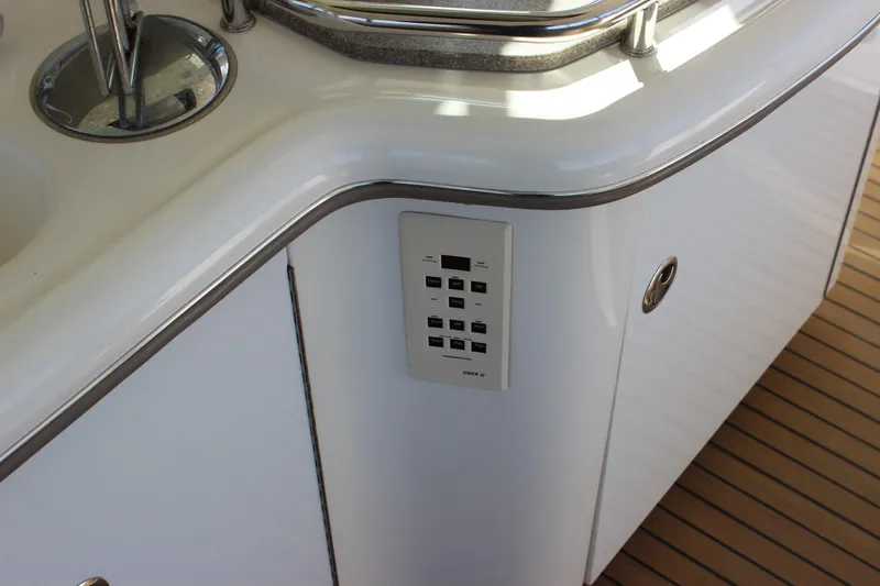 Slide: The Image of Control panel on the 2002 Sea Ray 480 Motor Yacht's sleek white interior. - 22
