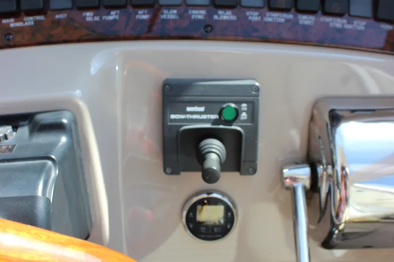 Slide: The Image of Control panel of a 2002 Sea Ray 480 Motor Yacht with bow thruster joystick. - 28