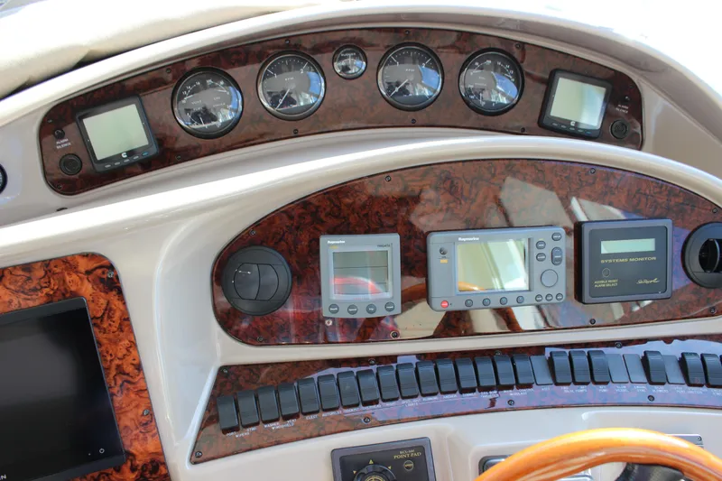Slide: The Image of Control panel of a 2002 Sea Ray 480 Motor Yacht with navigation instruments. - 29