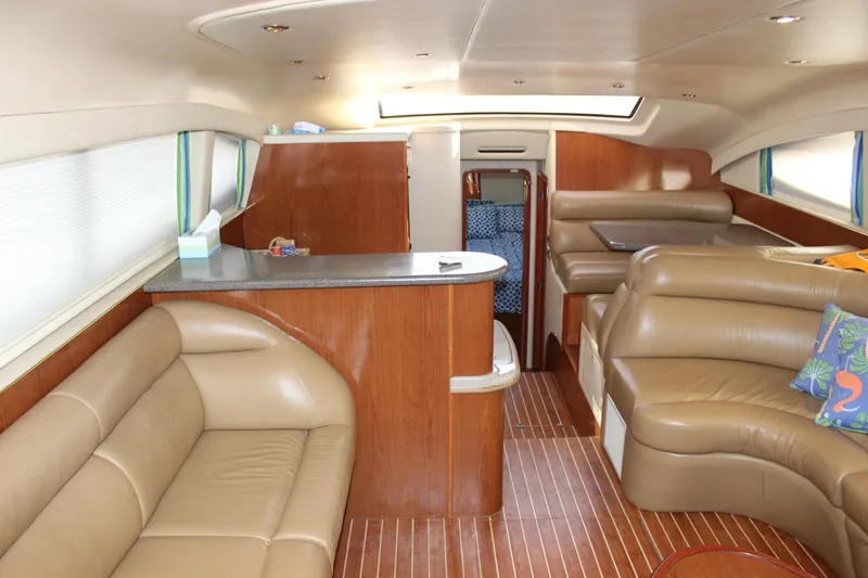 Slide: The Image of Interior of 2002 Sea Ray 480 Motor Yacht with leather seating and wooden finishes. - 33