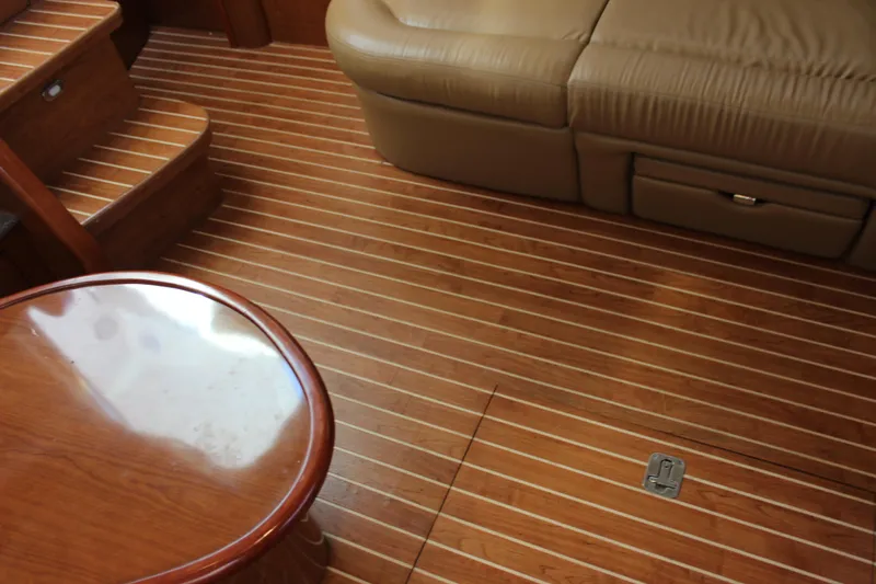 Slide: The Image of Interior of 2002 Sea Ray 480 Motor Yacht with wooden flooring and leather seating. - 38